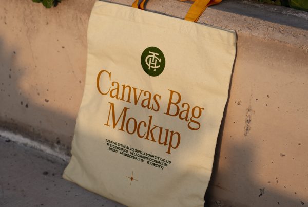 Front view, canvas bag mockup in crème color with an orange handle and green and orange typography design based on the concrete wall.