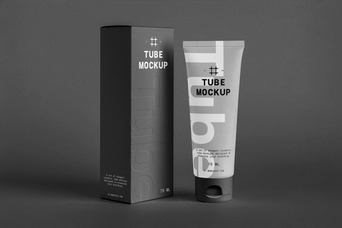 In the front view, a vertical Box Mockup and a Cosmetic Tube Mockup with delicate cosmetic designs in black, white, and gray colors stand next to each other on the dark background.