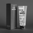 In the front view, a vertical Box Mockup and a Cosmetic Tube Mockup with delicate cosmetic designs in black, white, and gray colors stand next to each other on the dark background.