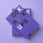 View from above, two hardcover book mockups with bold typography design in black, gold, purple, and white colors in PSD lying on top of each other for cover design and branding presentation on a purple background.