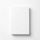 View from above, single white softcover book mockup for minimalist book cover and publishing design, lying on a white background.