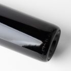 View from above the scene from Studio Wine Mockups of a close view of a black wine bottle lying on the white background.