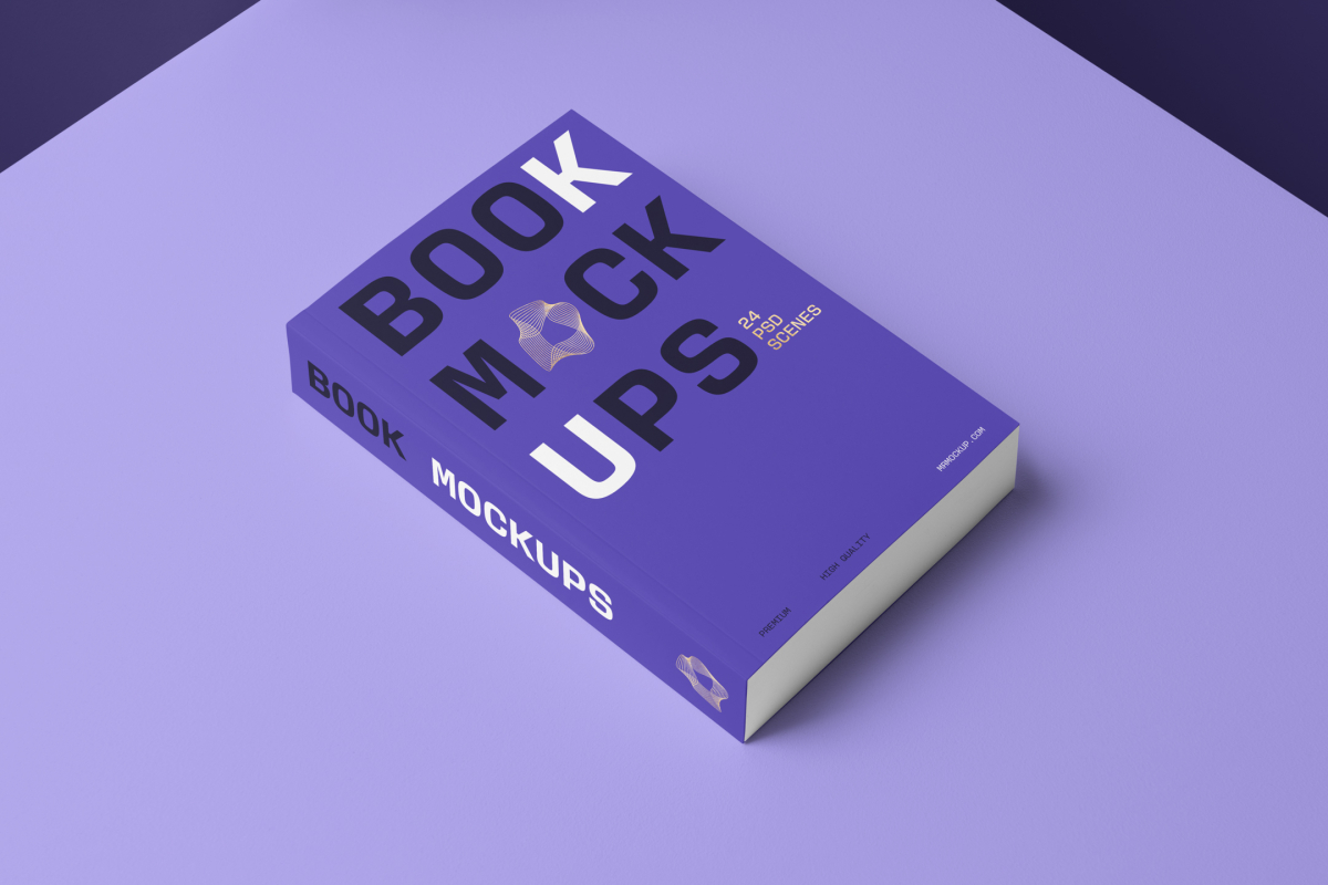 Top view at an angle of a softcover book mockup in PSD with bold typography design in black, gold, purple, and white colors showing the cover and spine in perspective view on the purple background.