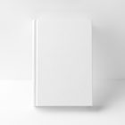 Front view, a white hardcover book mockup leaning against the white wall, stands facing forward on the white background.