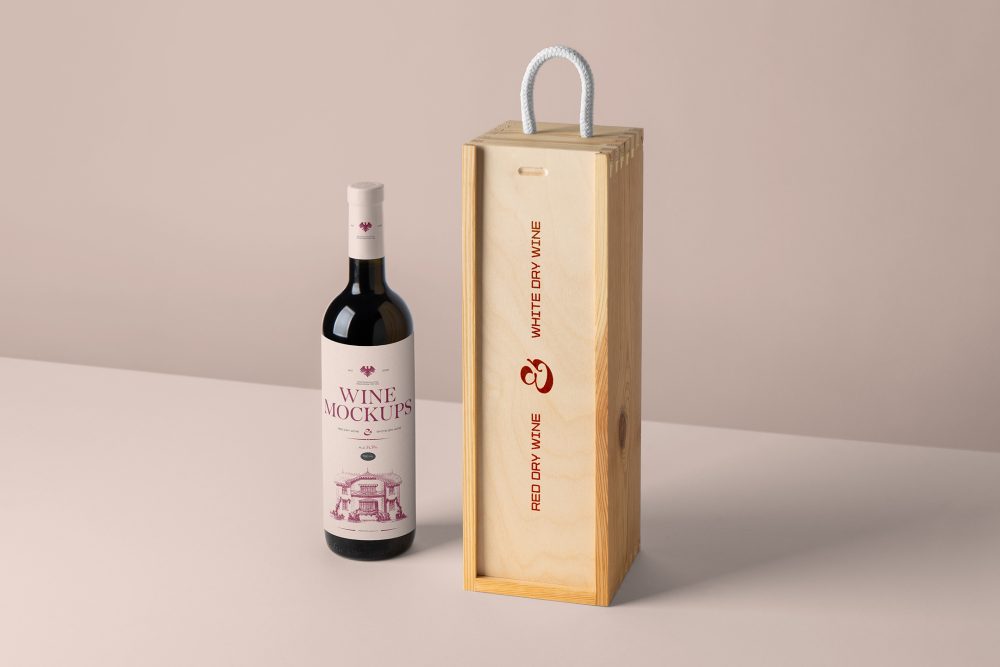 Front view, scene from Studio Wine Mockups of a standing black wine bottle with a pink label and typography design near a wooden wine box with typography design showing a burn effect on the pink background.