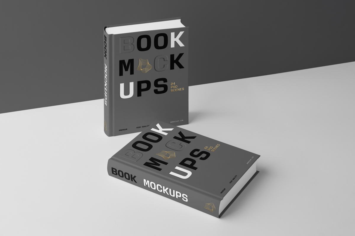 View from above, two hardcover book mockups with bold typography design in black, gold, gray, and white colors are located on the white background in perspective view.
