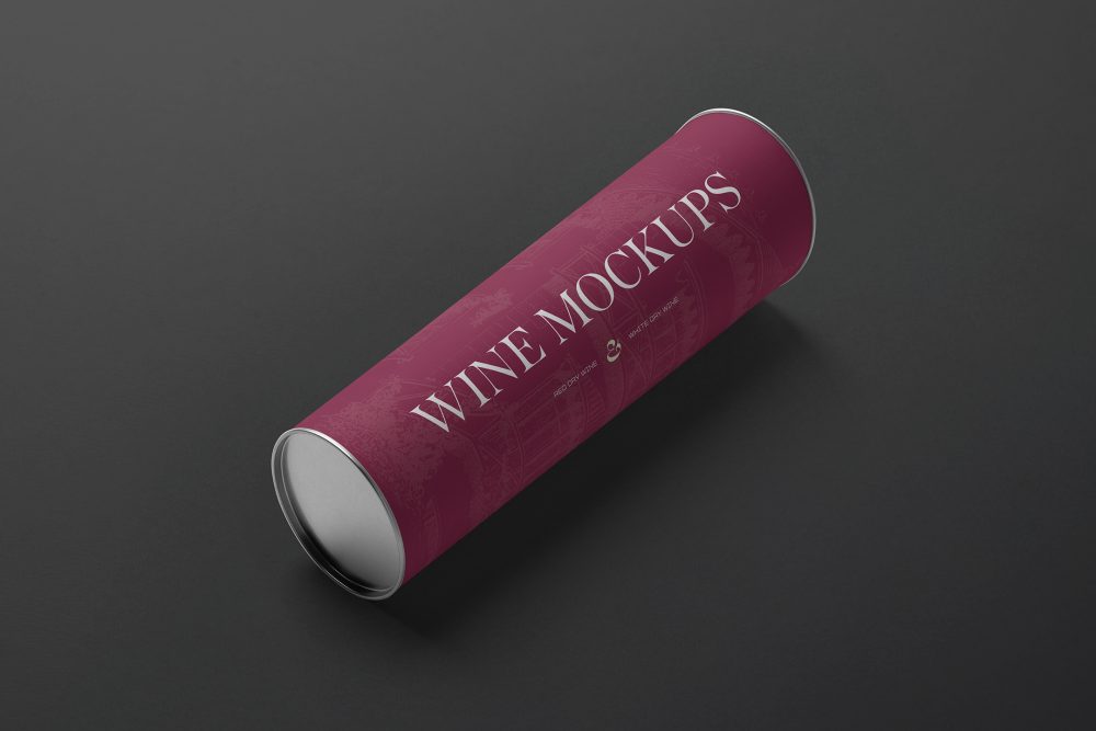 View from above the scene from Studio Wine Mockups of a wine tube package in claret color and typography design lying on the black background.