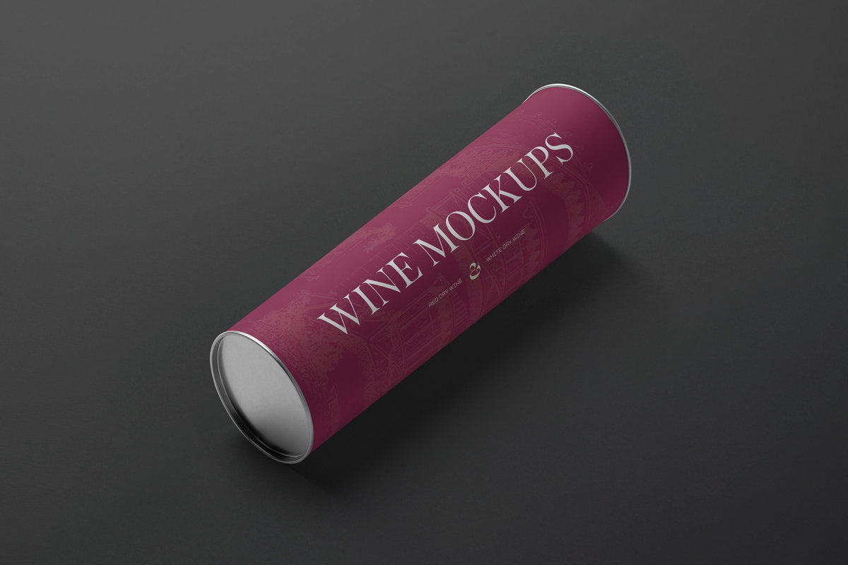 View from above the scene from Studio Wine Mockups of a wine tube package in claret color and typography design lying on the black background.