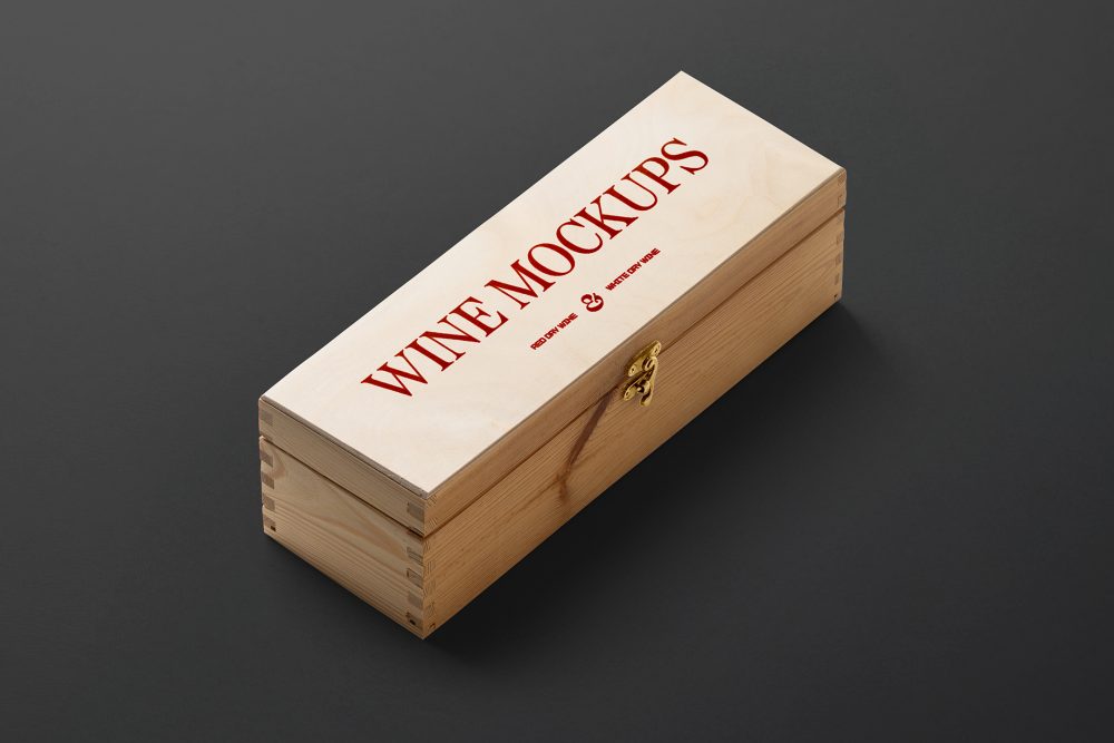 View from above, scene from Studio Wine Mockups of a closed wooden wine box with typography design showing a burn effect lying on the black background.
