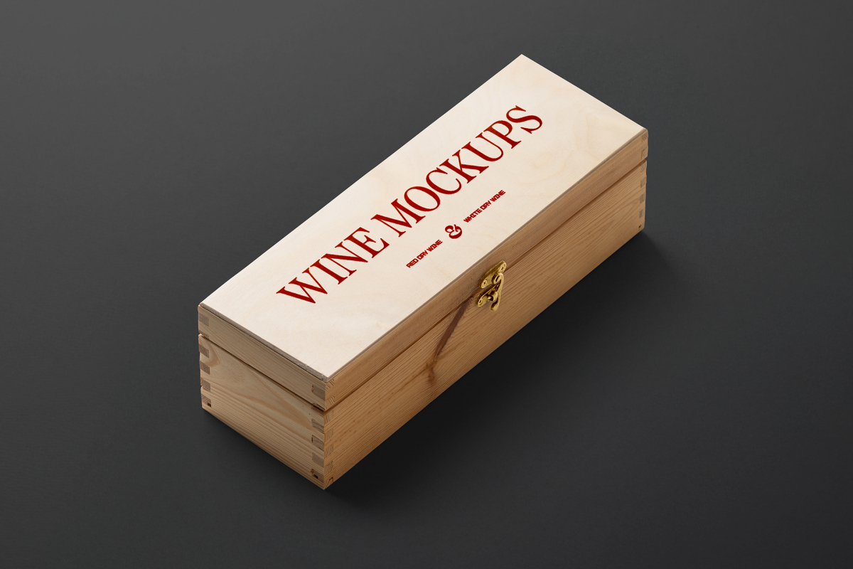 View from above, scene from Studio Wine Mockups of a closed wooden wine box with typography design showing a burn effect lying on the black background.