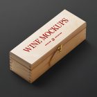 View from above, scene from Studio Wine Mockups of a closed wooden wine box with typography design showing a burn effect lying on the black background.