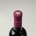 View from above, the scene from Studio Wine Mockups of a standing wine bottle with a claret plastic cap with typography design on the bright gray background.