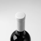 View from above, the scene from Studio Wine Mockups of a standing wine bottle with a white plastic cap on the white background.