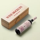 View from above, the scene from Studio Wine Mockups of a closed wooden wine box with a typography design showing a burn effect with a black bottle of wine with a pink label and typography design lying near on the bright green background.