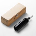 View from above, the scene from Studio Wine Mockups of a closed wooden wine box with a black bottle of wine lying near on the white background.