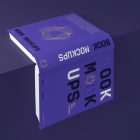View from above, an open hardcover book mockup with bold typography design in black, gold, purple, and white colors lying on the edge of the purple cube.