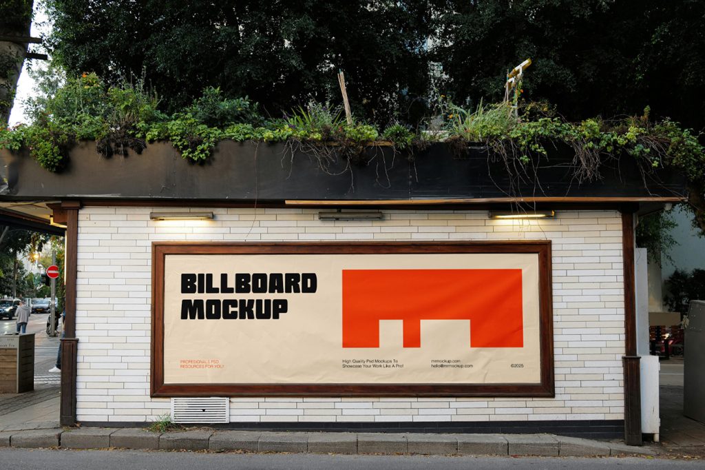 Front view, horizontal billboard with a golden frame and strong typography design in black and orange colors attached to the building's white brick facade.