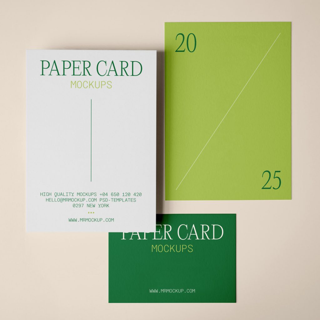 View from above, three a Paper Card Mockup in two sizes and a delicate typography design in green and lime colors are lying on the beige floor.