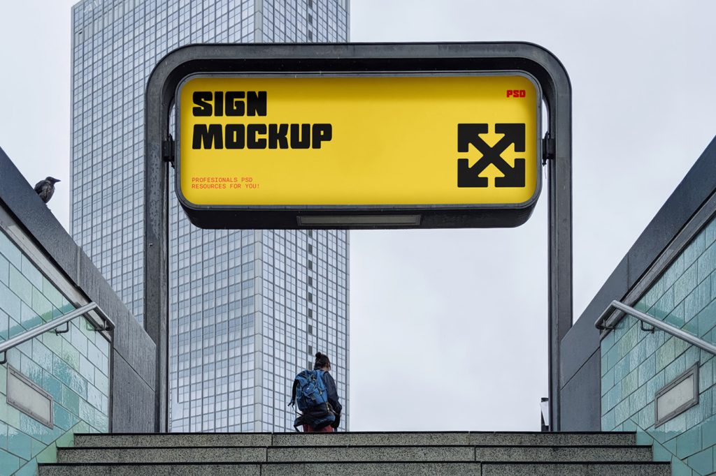 Front view, horizontal, yellow sign mockup with strong black and red typography design appearing at the exit of the subway.