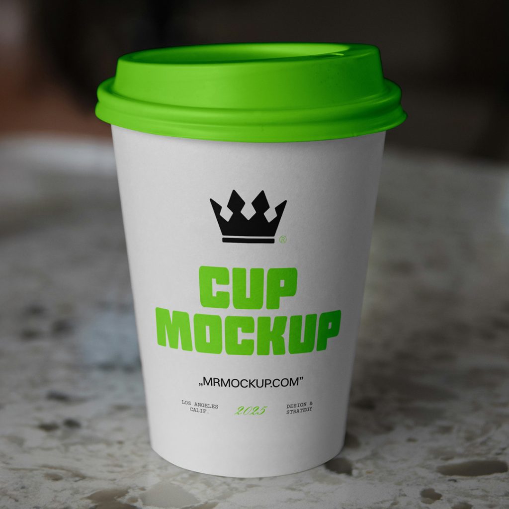 Front view, a white coffee cup mockup with a strong typography design standing on the marble table.