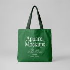 Front view, green canvas bag mockup with typography design in white color from studio apparel mockups product.