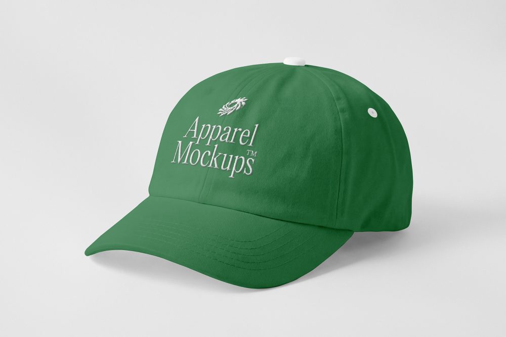 Front view, lying green baseball cap mockup with white typography design on the grey studio background from the studio apparel mockups product.