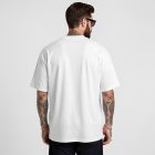 Front view, male model backward wearing a white t-shirt mockup standing against a white studio background from the studio apparel mockups product.