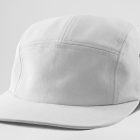Front view, lying white five panel cap mockup on the white studio background from the studio apparel mockups product.