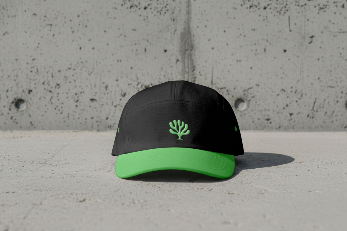 Cap mockup lying on the concrete slab from the Outdoor Apparel Mockups Vol.3 product.