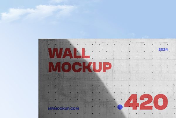 Front view a concrete wall mockup with red and blue typography design against the sky view.