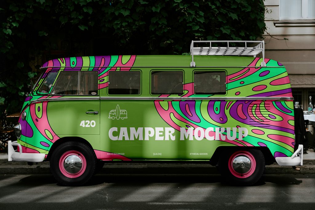Front view of hippie camper mockups on the side in colorful colors and white typography parked near the sidewalk.