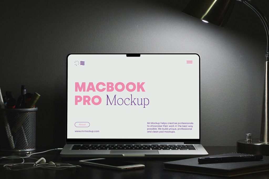 Front view MacBook Pro mockup with typography design on the screen lying on the black desk.