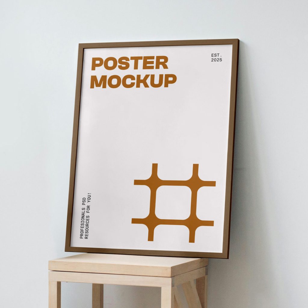 Front view poster mockup with a brown frame and typography design standing on a wooden stool.