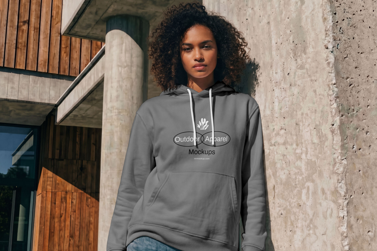Standing female model wearing gray hoodie mockup from the Outdoor Apparel Mockups Vol.3 product.
