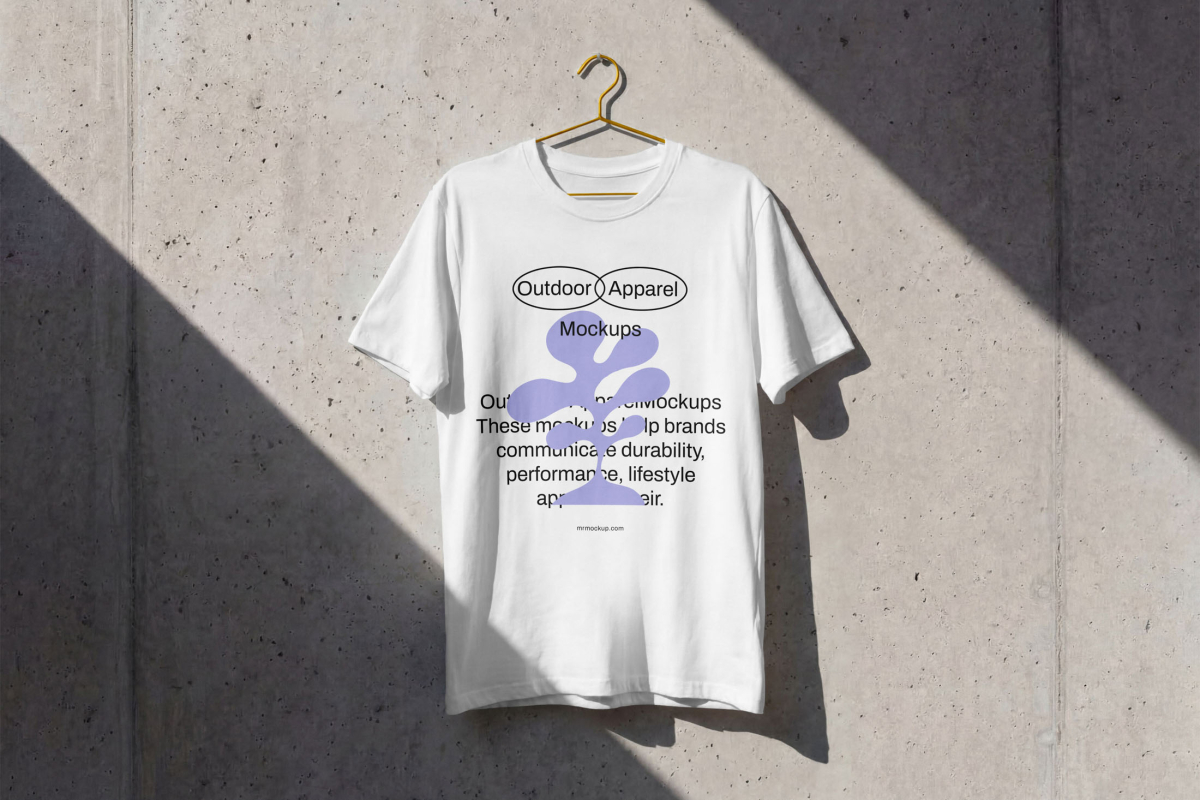 Front view, white t-shirt mockup with white logo hanging on the concrete wall from the Outdoor Apparel Mockups Vol.3 product.