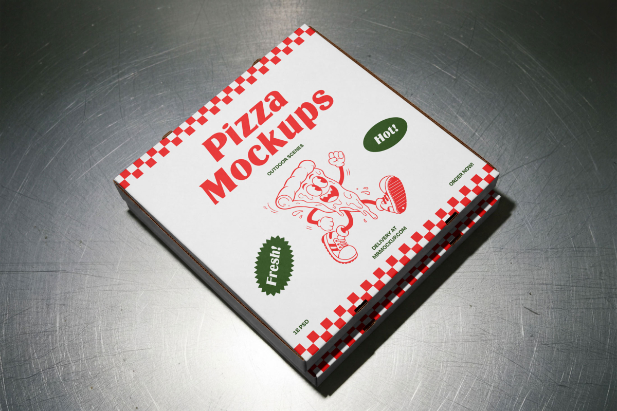 A stack of two white pizza boxes with red checkered edges resting on a metallic stainless steel surface. The top box prominently displays the red "Pizza Mockups" logo and a cartoon pizza character.