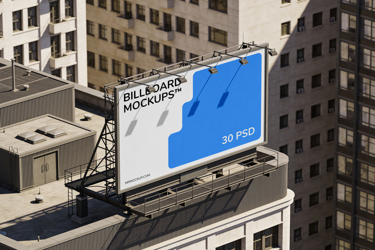 High-angle aerial view of a large rooftop billboard with spotlights, set on top of a building surrounded by city skyscrapers.