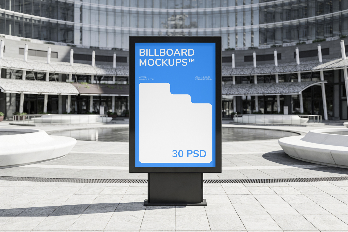Freestanding vertical ad display in the middle of a modern paved plaza with circular fountains and a curved glass facade background.
