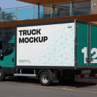 Three-quarter side view of a teal delivery box truck with a white cargo box and teal rear doors featuring a large number 12.