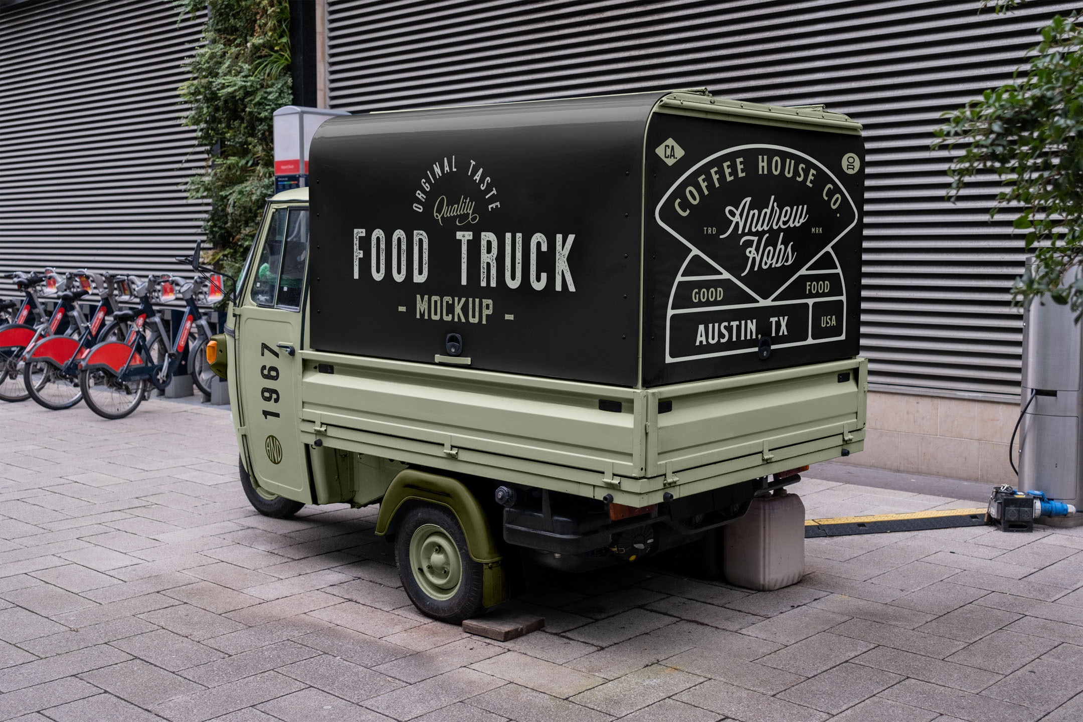 Small-Food-Truck-Mockup-A Rear three-quarter view of a light green Piaggio Ape mobile coffee truck mockup parked on a paved walkway.