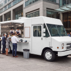 White step van food truck mockup with open hatch and a queue of business customers outside a corporate office building.