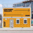 Front view of two stacked yellow modular office containers with custom branding at a construction site.