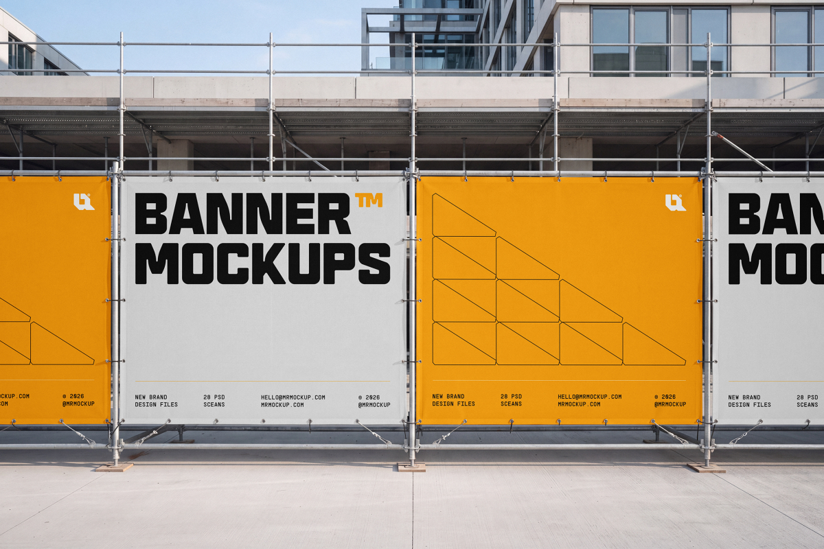Row of alternating white and yellow printed banners fixed to scaffolding along a site barrier.