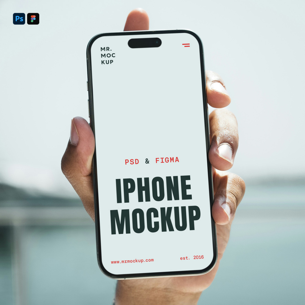 A close-up shot of a person's hand holding a modern iPhone Pro vertically toward the camera, featuring a blank white screen with a Dynamic Island display notch. The background shows a soft-focus, bright outdoor setting with a blurred view of a water feature and a man wearing sunglasses partially visible on the left. Free iPhone Pro Scene PSD Mockup