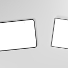 Top-down view of two foldable smartphones lying on a gray surface, one fully open and one folded with blank white screens.