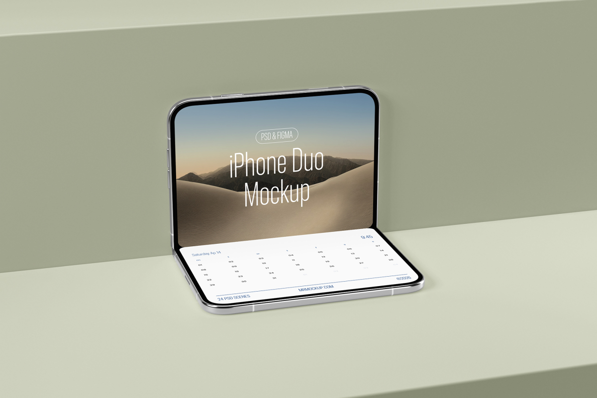 Front perspective view of a partially folded silver smartphone standing open on a green display shelf, showing a desert wallpaper on top and a calendar interface below.