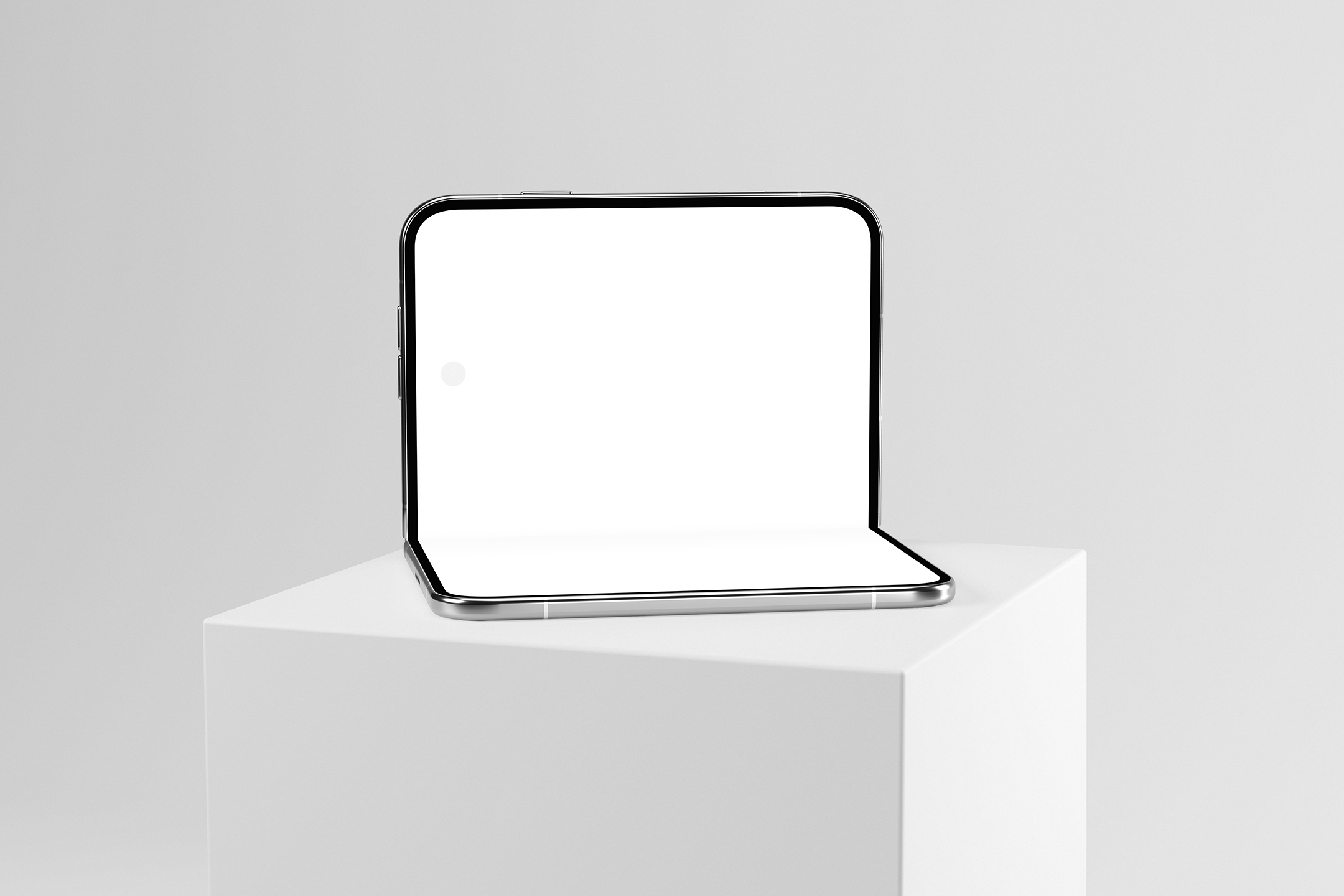 Front view of a partially open foldable smartphone sitting on a white pedestal showcase with a blank white screen.